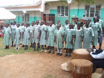 Pupils of St. Jude Banda Primary School entertaining the audience with a song during commissioning
