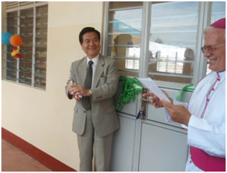 H. E. Kazuo Minagawa after cutting the tape
