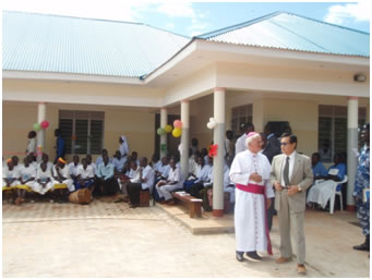 Bishop Lira Diocese and The Ambassadorin front of newly built OPD