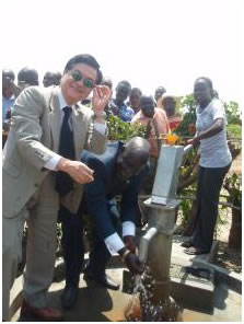 the ambasador and hon. state minister washing their hands