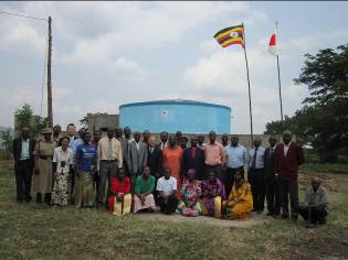 Commemorative photo in front of water tank 