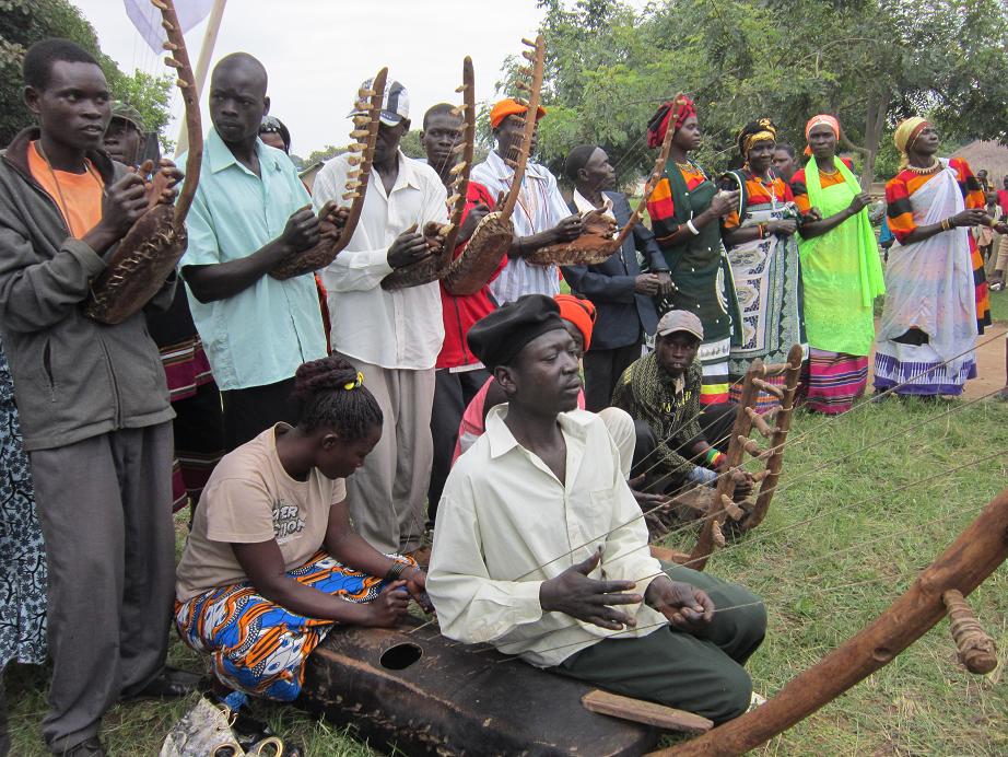 Community people playing traditional music instruments for the celebration