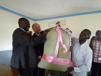 Counselor receiving a gift from the local farmers