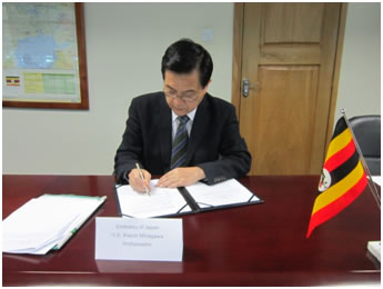 Ambassador signing in the Grant Contract
