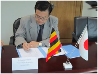 Ambassador signing the Grant Contract